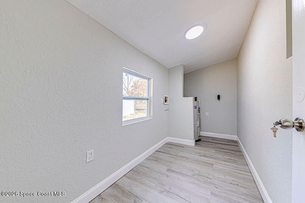 2773 Hickory Circle Mims, FL 32754 - Photo 38 of 45 a view of a livingroom with wooden floor and window