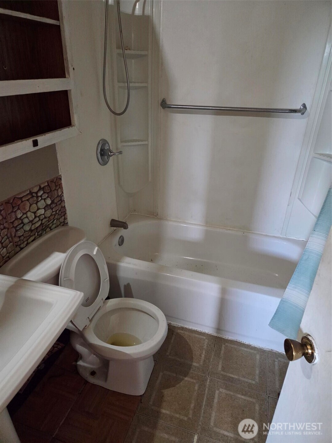 12001 Spanaway Loop Road South Tacoma, WA 98444 - Photo 14 of 20 a bathroom with a toilet and a shower