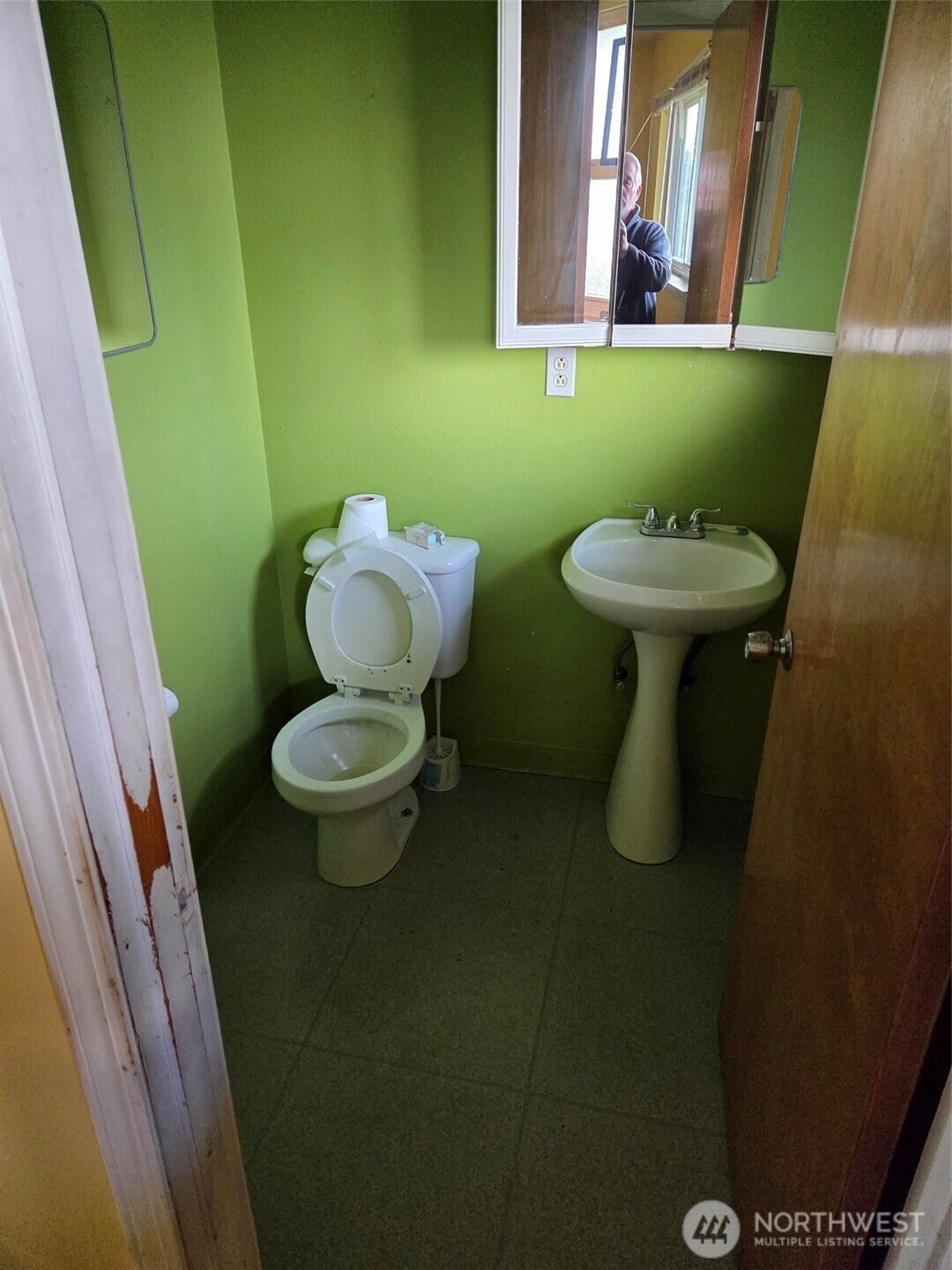 12001 Spanaway Loop Road South Tacoma, WA 98444 - Photo 15 of 20 a bathroom with a toilet and a sink