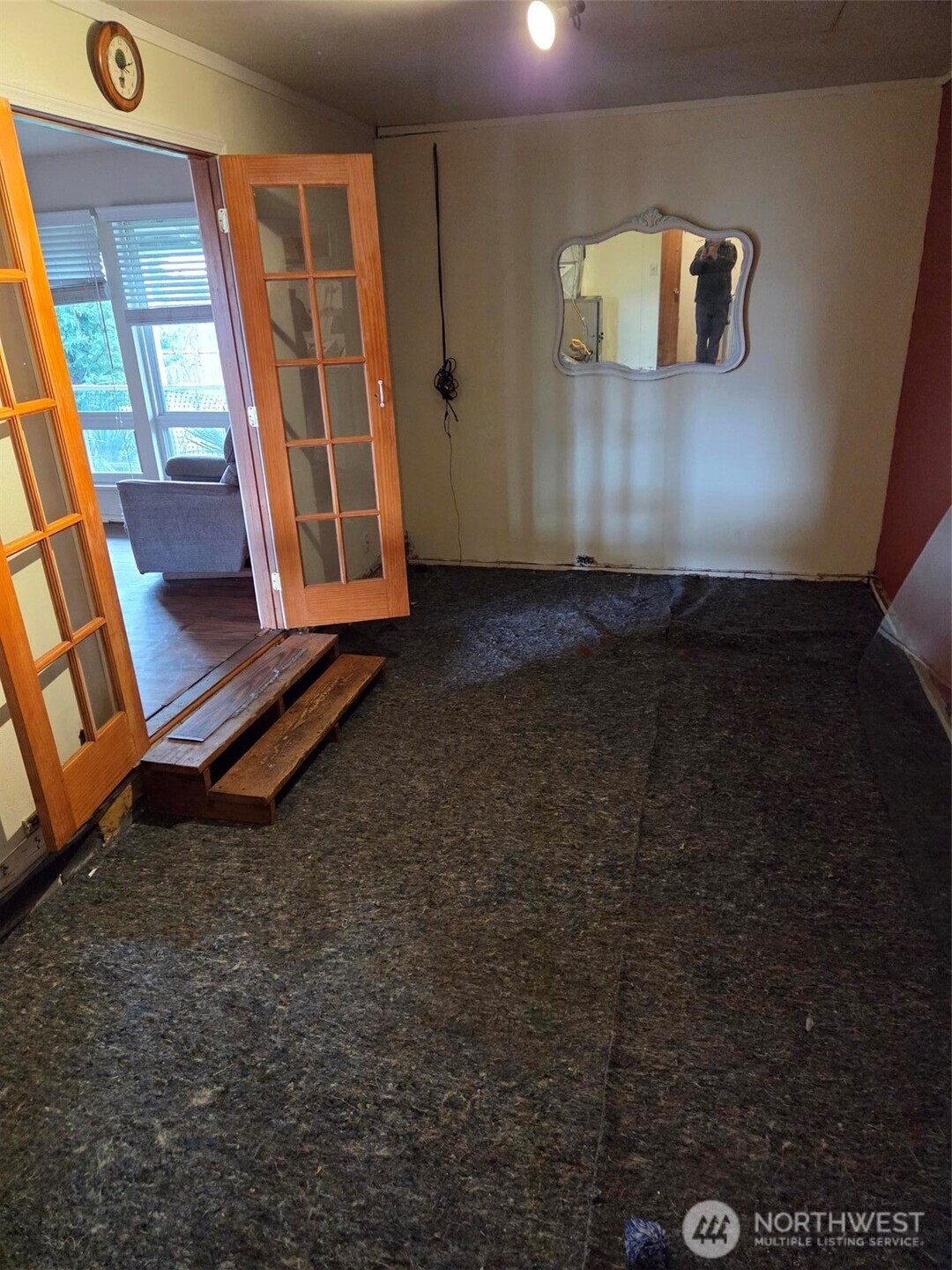 12001 Spanaway Loop Road South Tacoma, WA 98444 - Photo 6 of 20 a room with gym equipment and large window