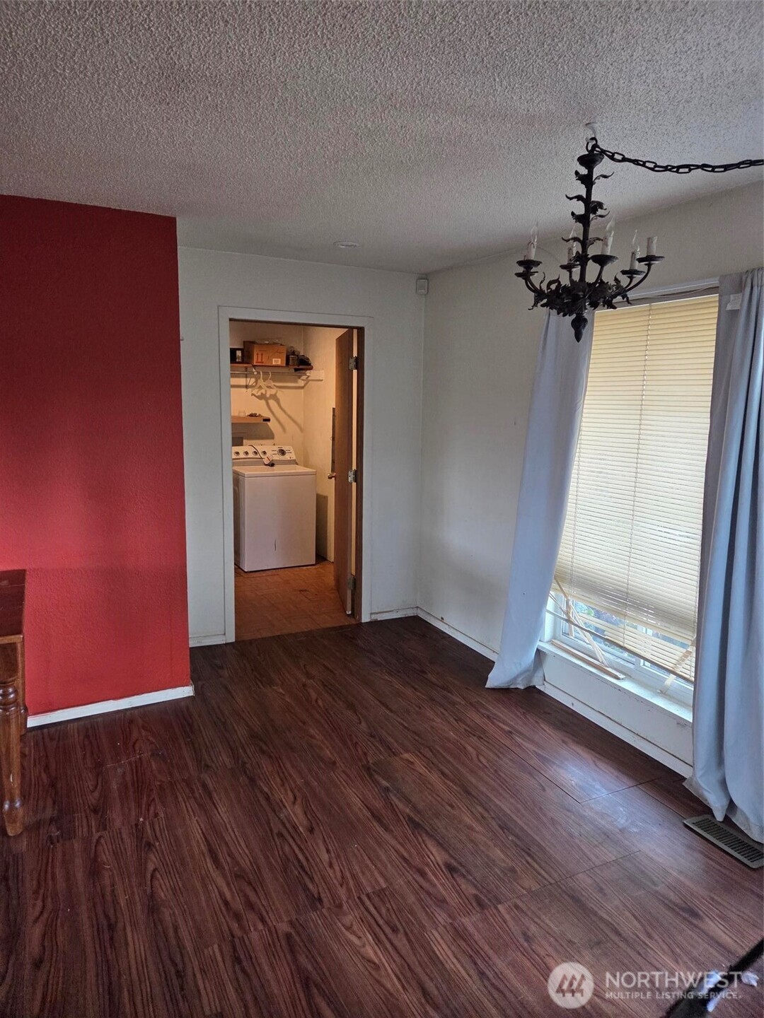 12001 Spanaway Loop Road South Tacoma, WA 98444 - Photo 7 of 20 a view of empty room with wooden floor