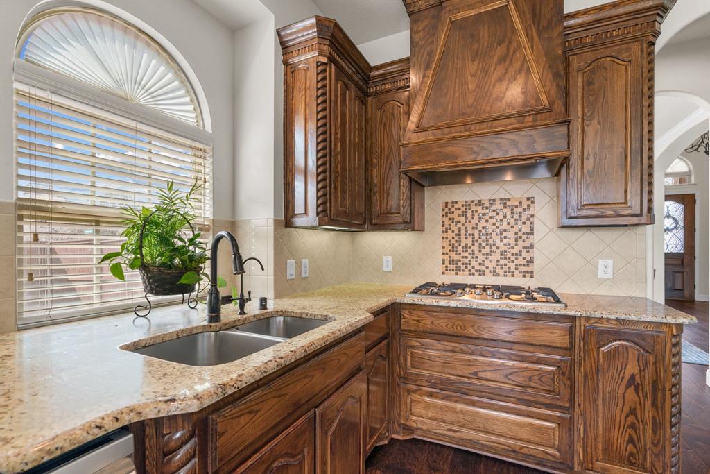 2500 Strathfield Lane Trophy Club, TX 76262 - Photo 11 of 34 Garden window and gas cooktop