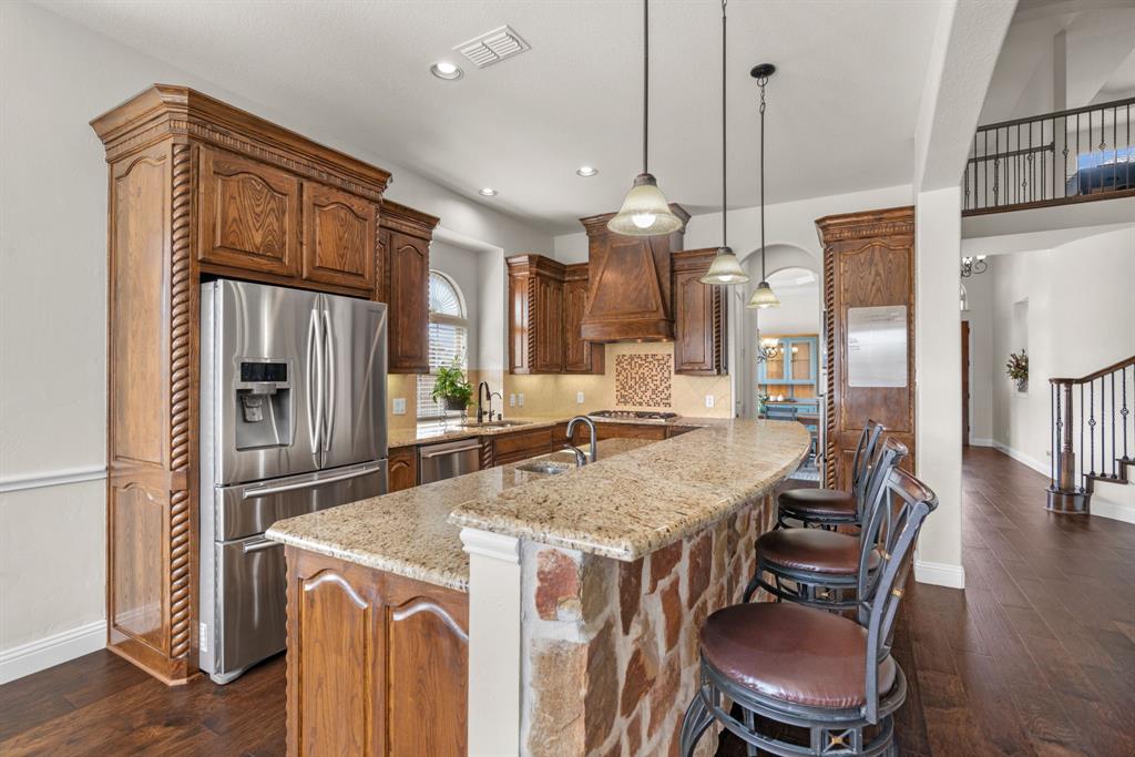 2500 Strathfield Lane Trophy Club, TX 76262 - Photo 12 of 34 Breakfast bar and second sink are perfect for entertaining