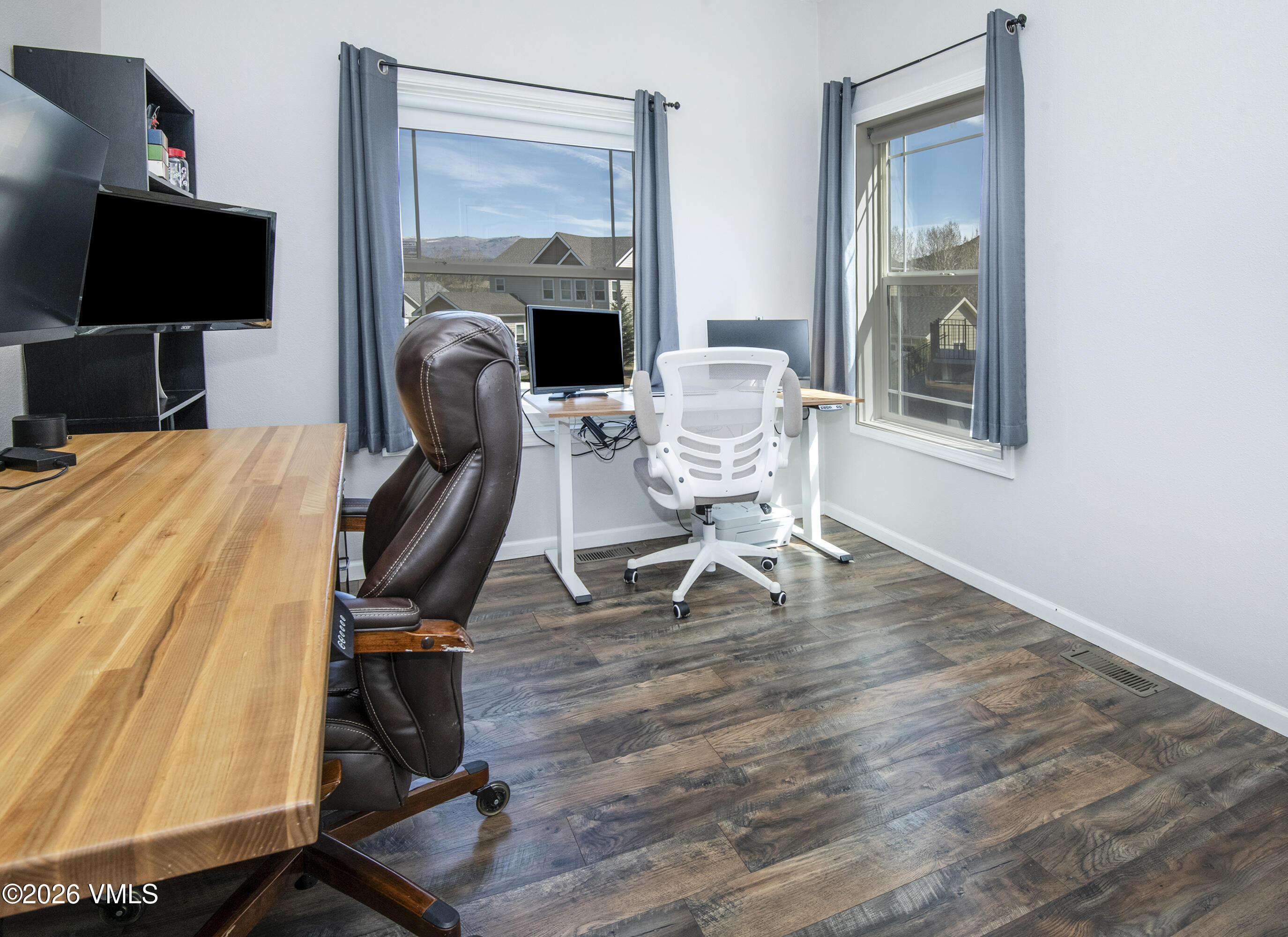 67 Maverick Court Gypsum, CO 81637 - Photo 21 of 40 a work room with furniture and a flat screen tv