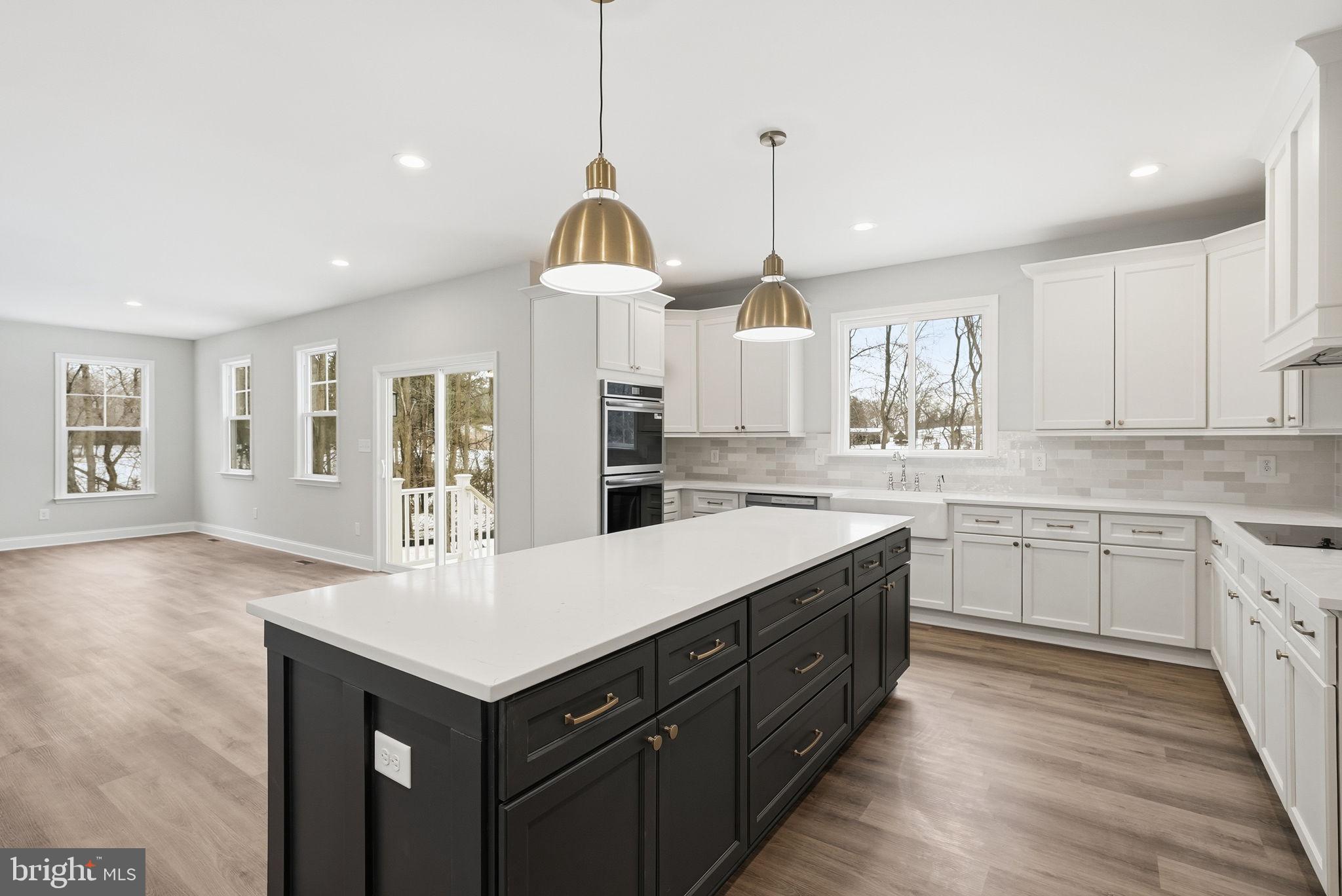 9586 South Pines Road Warrenton, VA 20186 - Photo 23 of 53 a kitchen with a sink center island and stainless steel appliances