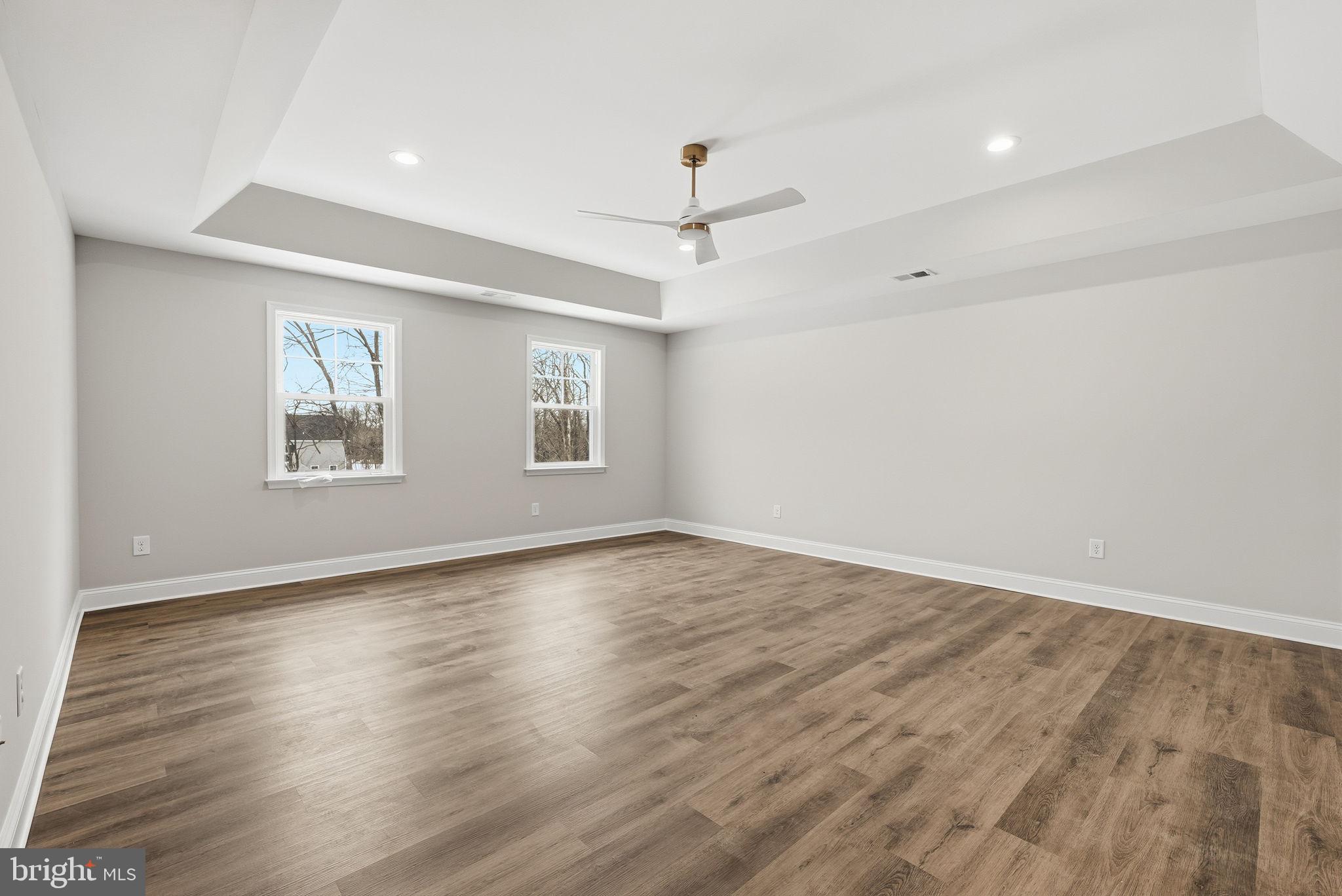 9586 South Pines Road Warrenton, VA 20186 - Photo 28 of 53 a view of an empty room with wooden floor and a window