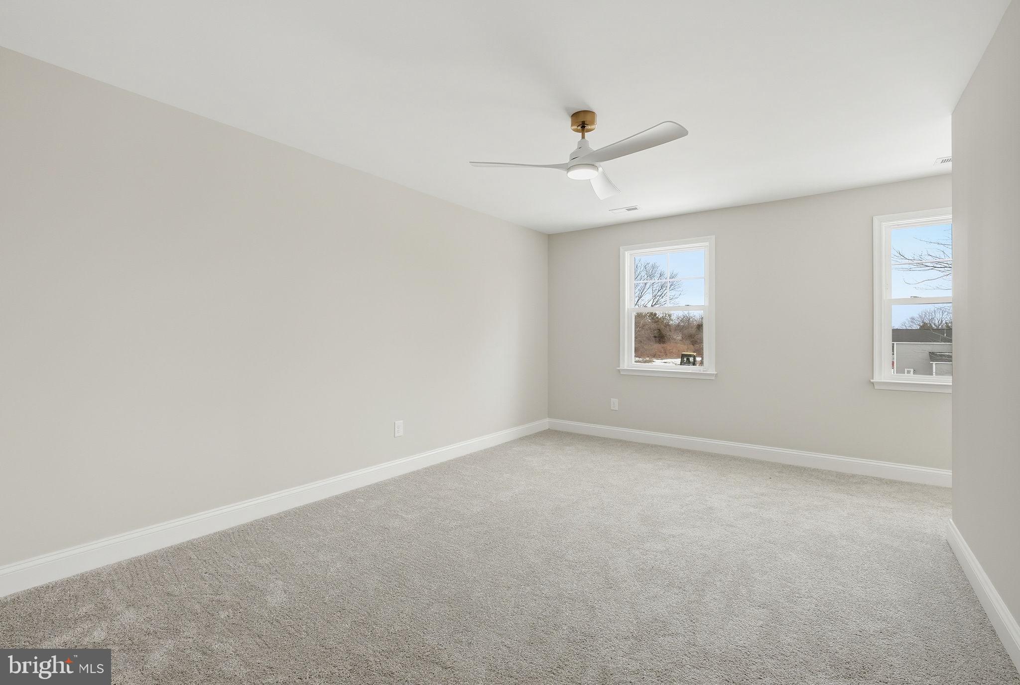 9586 South Pines Road Warrenton, VA 20186 - Photo 36 of 53 an empty room with a window and ceiling fan
