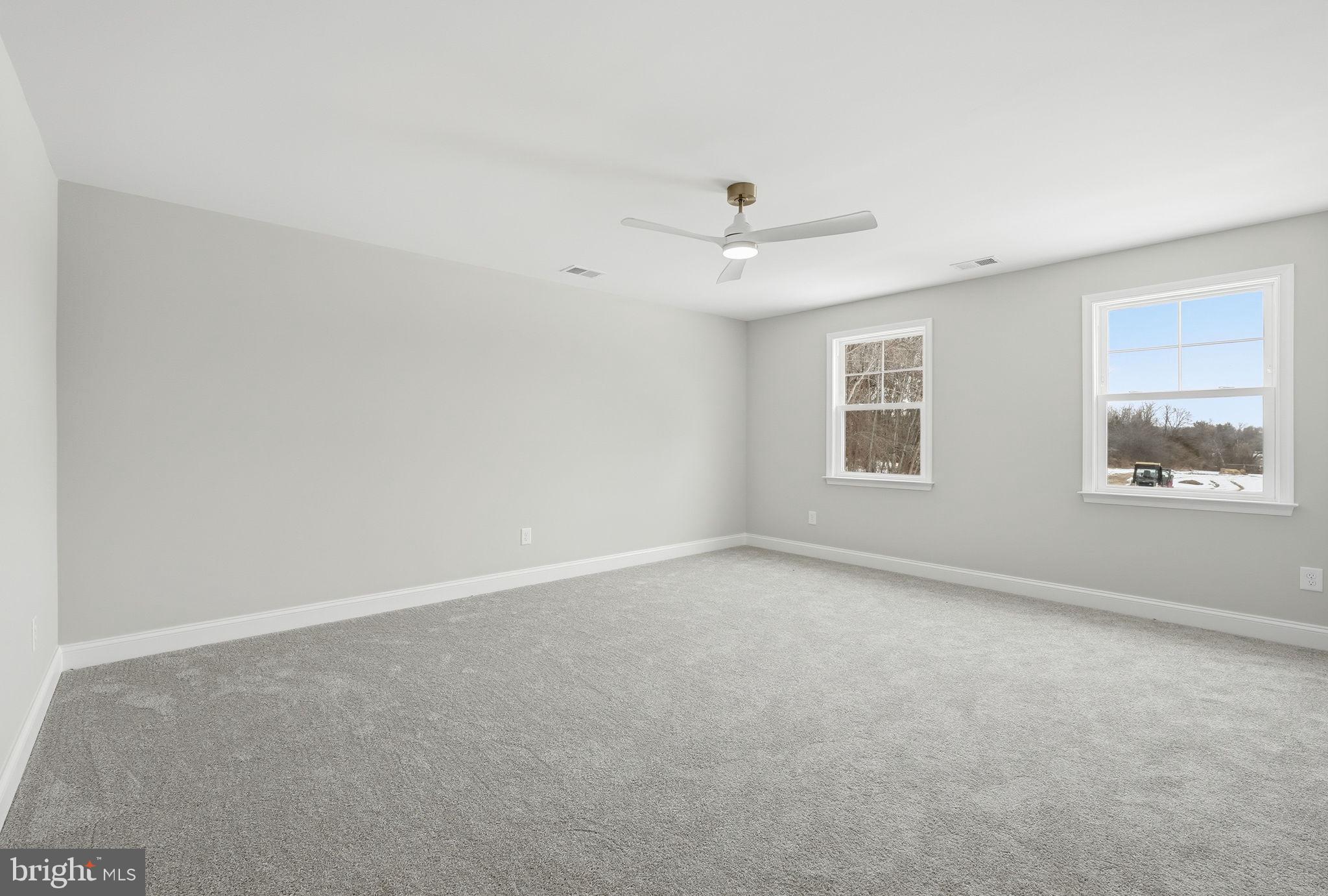 9586 South Pines Road Warrenton, VA 20186 - Photo 42 of 53 an empty room with a window and ceiling fan