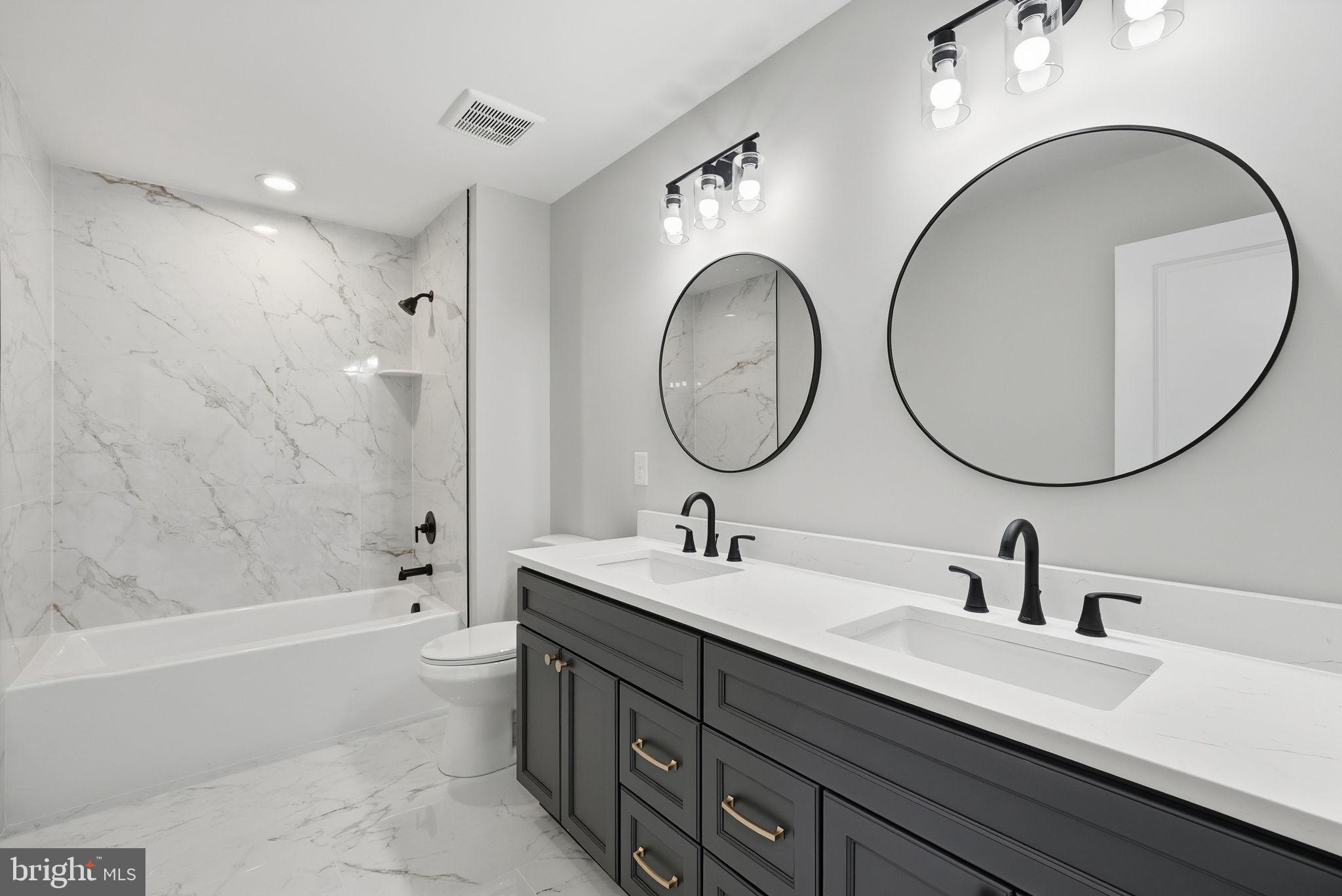 9586 South Pines Road Warrenton, VA 20186 - Photo 43 of 53 a bathroom with a double vanity sink and a mirror