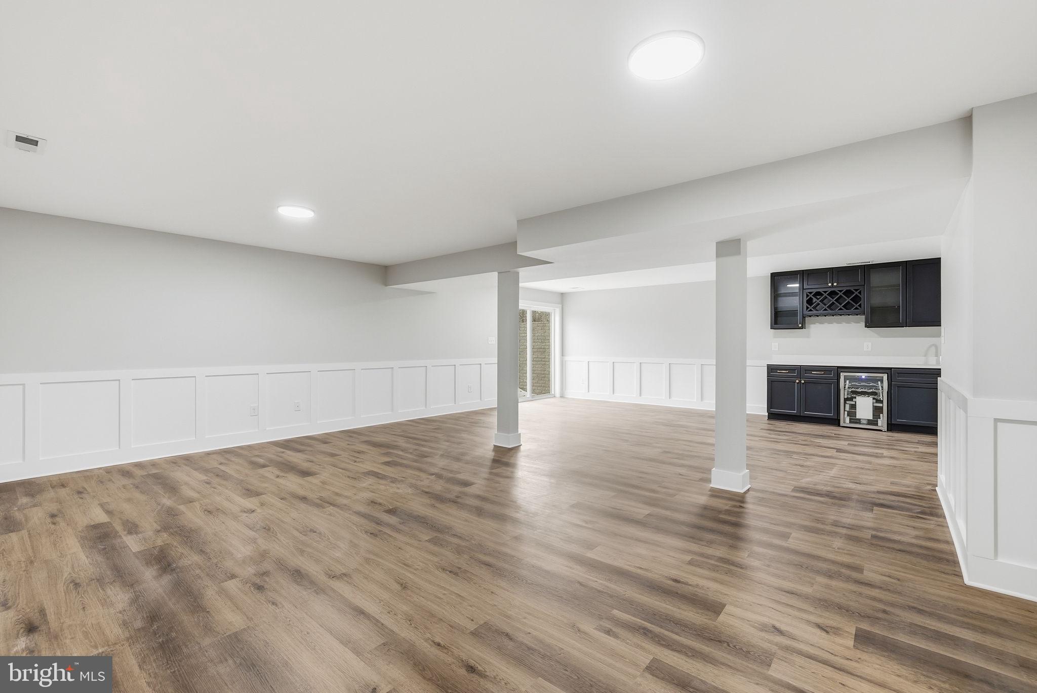 9586 South Pines Road Warrenton, VA 20186 - Photo 45 of 53 a view of empty room with wooden floor and fireplace