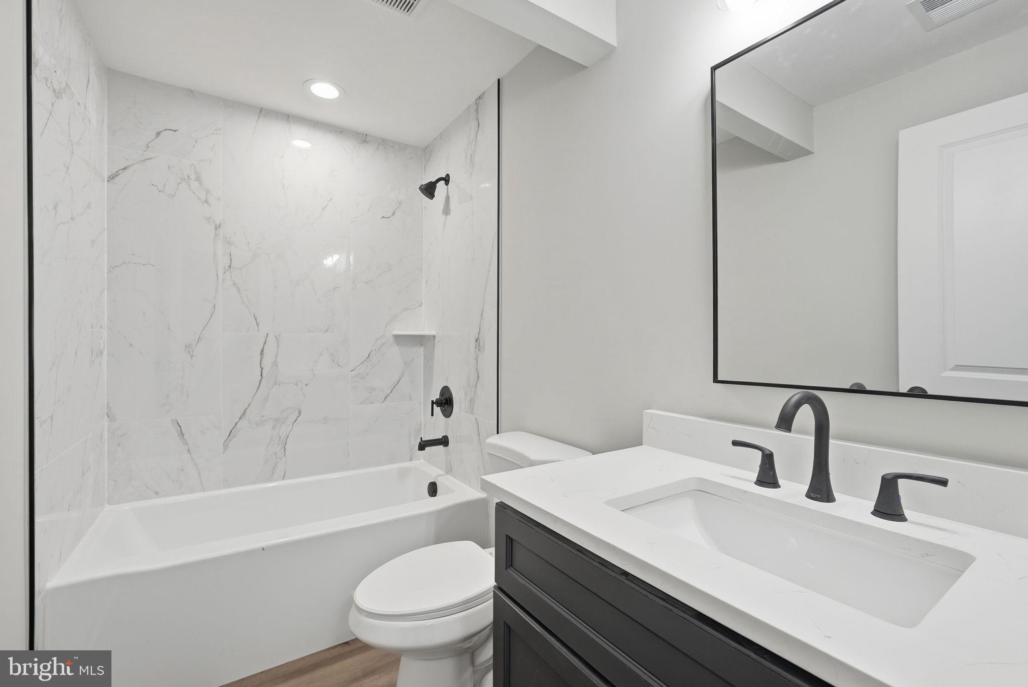9586 South Pines Road Warrenton, VA 20186 - Photo 49 of 53 a bathroom with a sink toilet vanity and shower