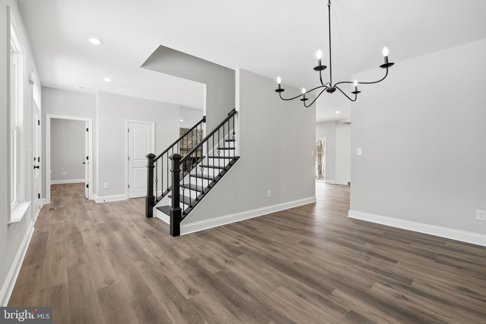 9586 South Pines Road Warrenton, VA 20186 - Photo 7 of 53 a view of a room with wooden floor and stairs