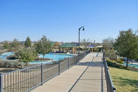 a picture of a room with a cabinet and mirror