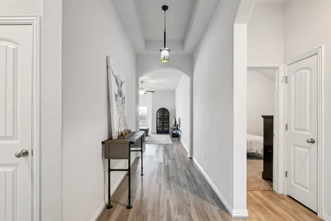 a view of a hallway with a livingroom