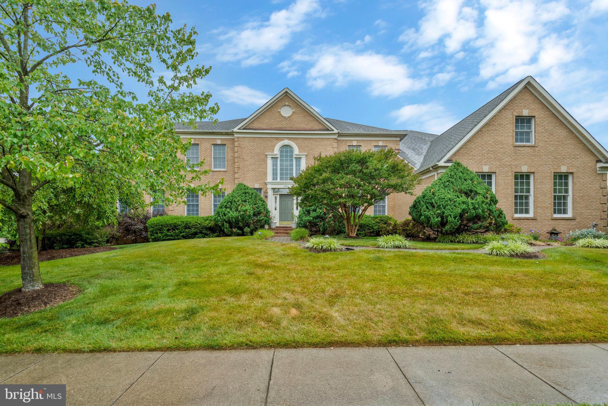 19783 Willowdale Place Ashburn, VA 20147 - Photo 1 of 76 a front view of house with yard and green space