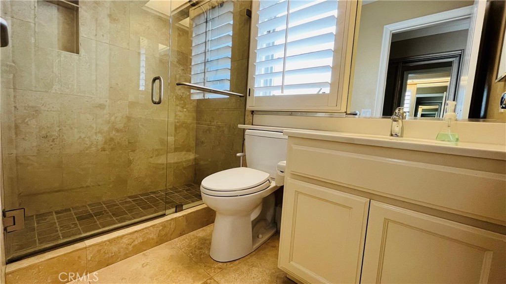 19 Terraza Del Mar Dana Point, CA 92629 - Photo 11 of 25 a bathroom with a sink and a shower