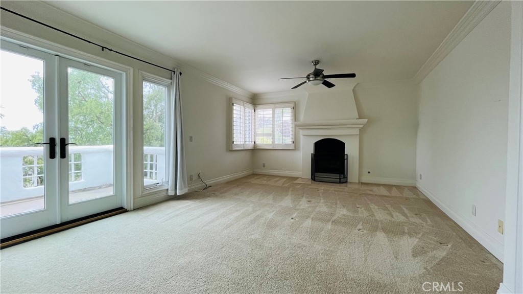 19 Terraza Del Mar Dana Point, CA 92629 - Photo 15 of 25 an empty room with windows and fireplace