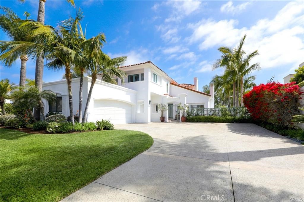 19 Terraza Del Mar Dana Point, CA 92629 - Photo 2 of 25 a front view of a house with a garden