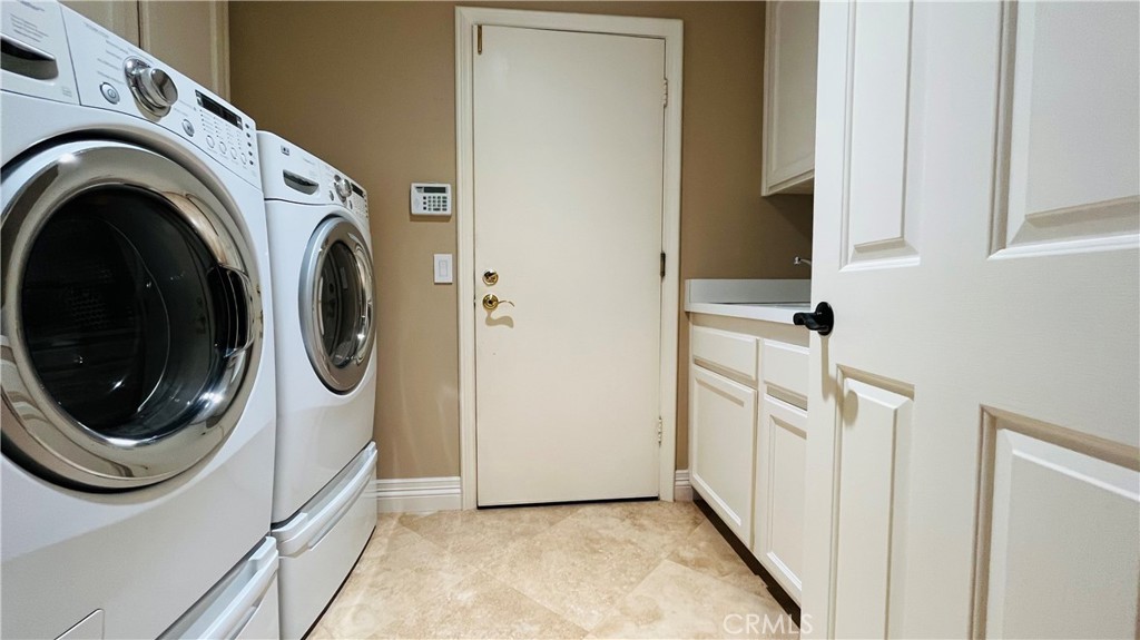 19 Terraza Del Mar Dana Point, CA 92629 - Photo 22 of 25 a view of a hallway with washer and dryer