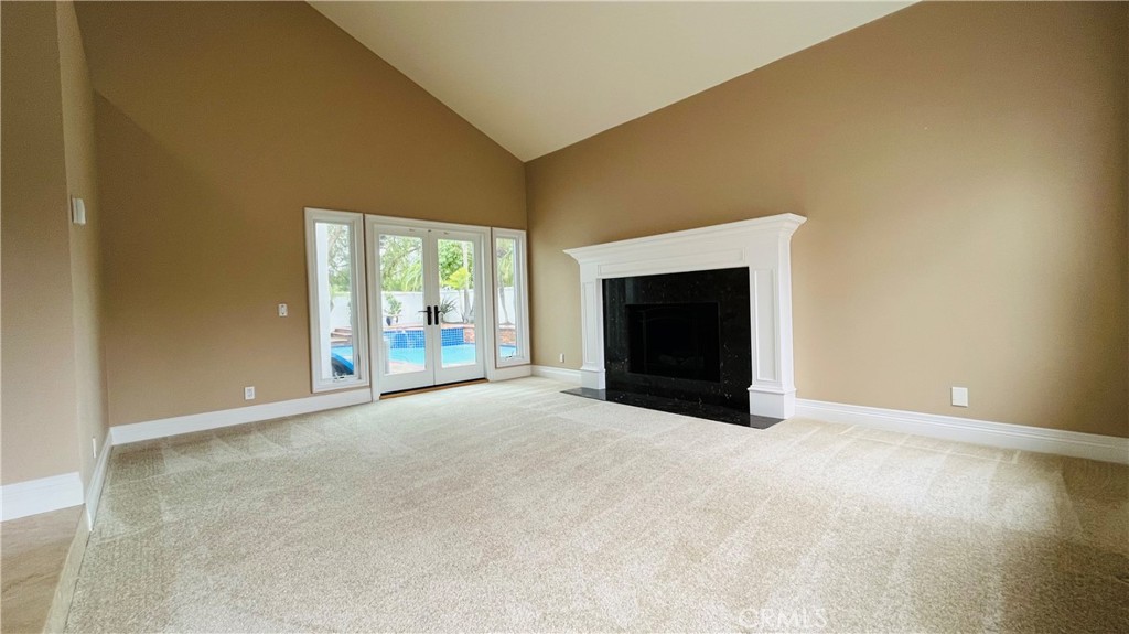 19 Terraza Del Mar Dana Point, CA 92629 - Photo 7 of 25 a view of an empty room with a fireplace and a window
