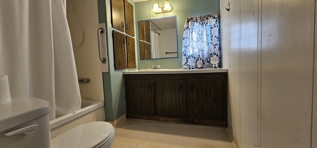 46 Madden Road, Unit 39 West Brookfield, MA 01585 - Photo 12 of 15 a bathroom with a sink a toilet and shower
