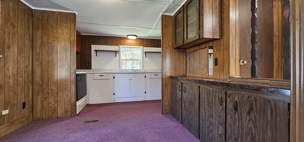 a view of a kitchen with electric appliances