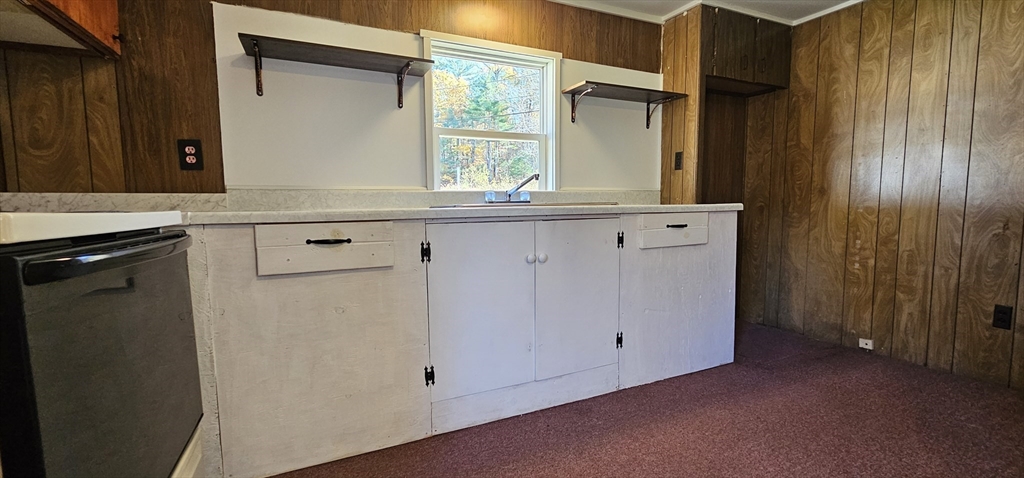 46 Madden Road, Unit 39 West Brookfield, MA 01585 - Photo 5 of 15 a kitchen with a sink and a mirror