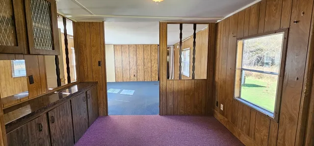 a view of a hallway with windows