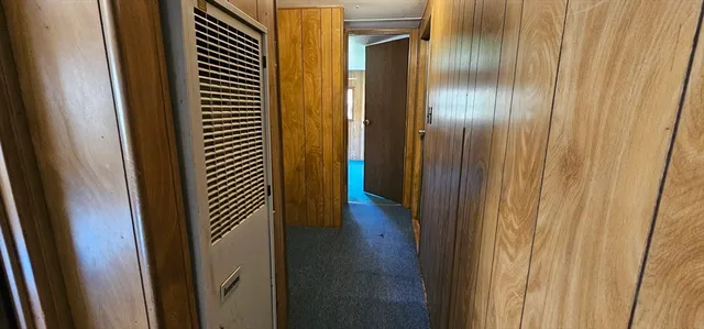 a view of a bathroom from a hallway