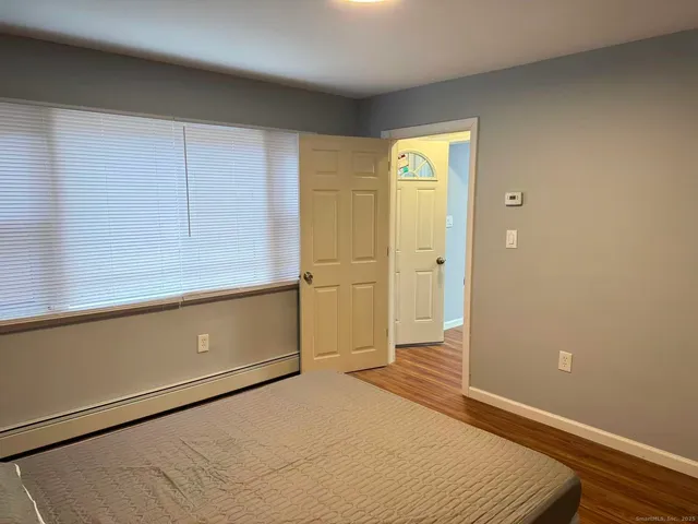 a bathroom with a glass shower door