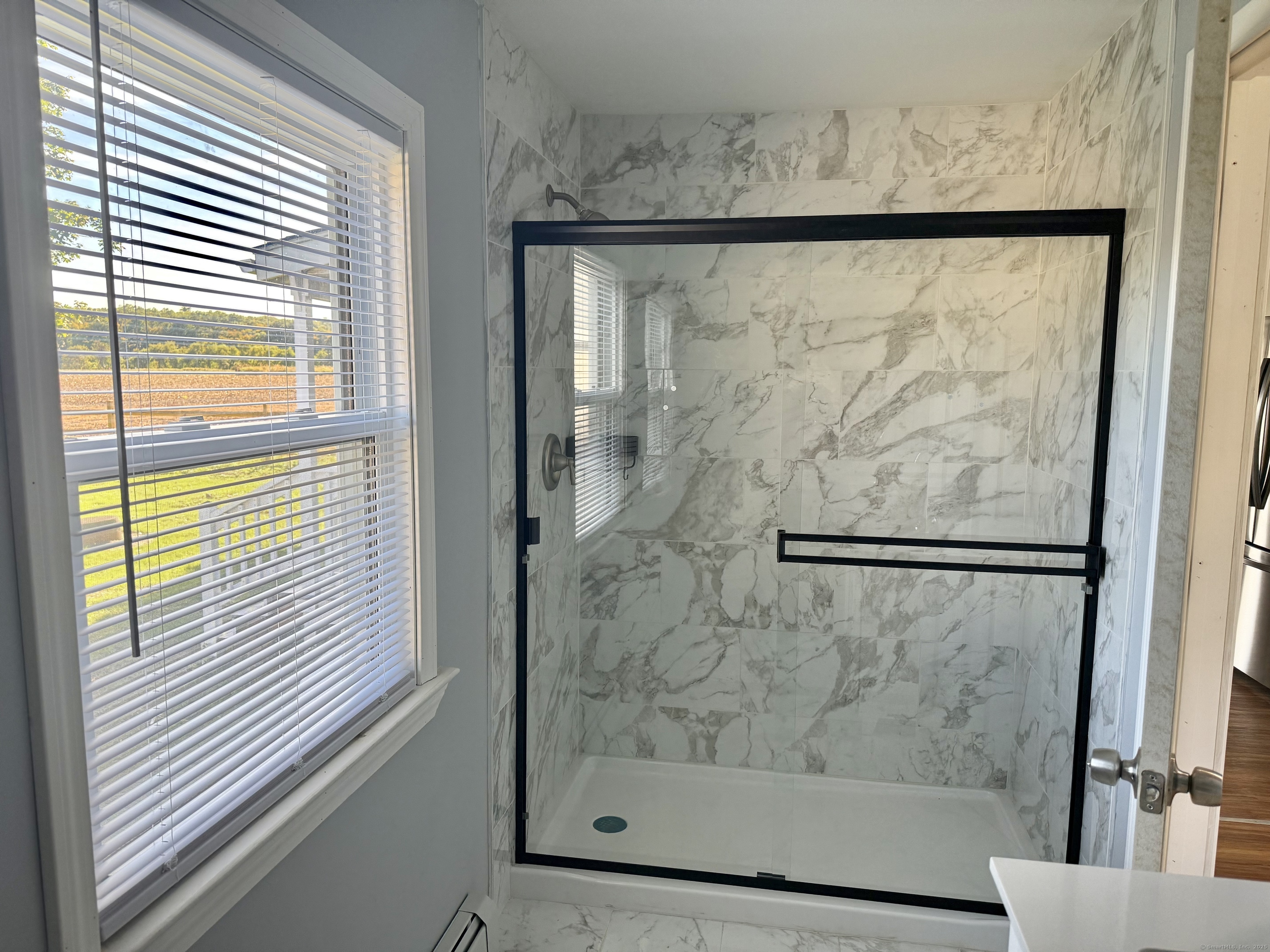 151 Bitgood Road Griswold, CT 06351 - Photo 12 of 20 a bathroom with a glass shower door