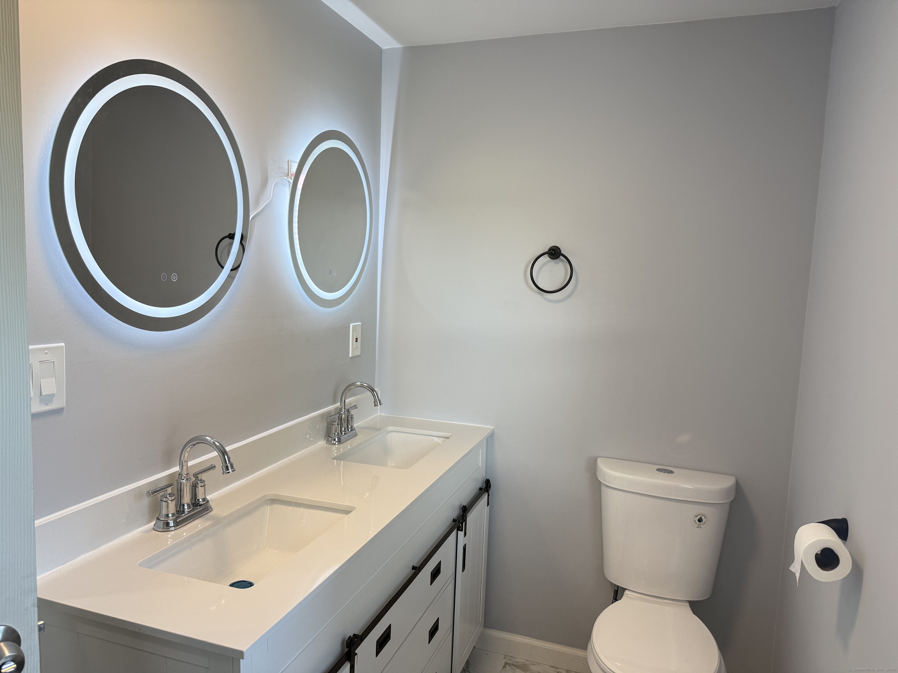 151 Bitgood Road Griswold, CT 06351 - Photo 13 of 20 a bathroom with a toilet a sink and a mirror