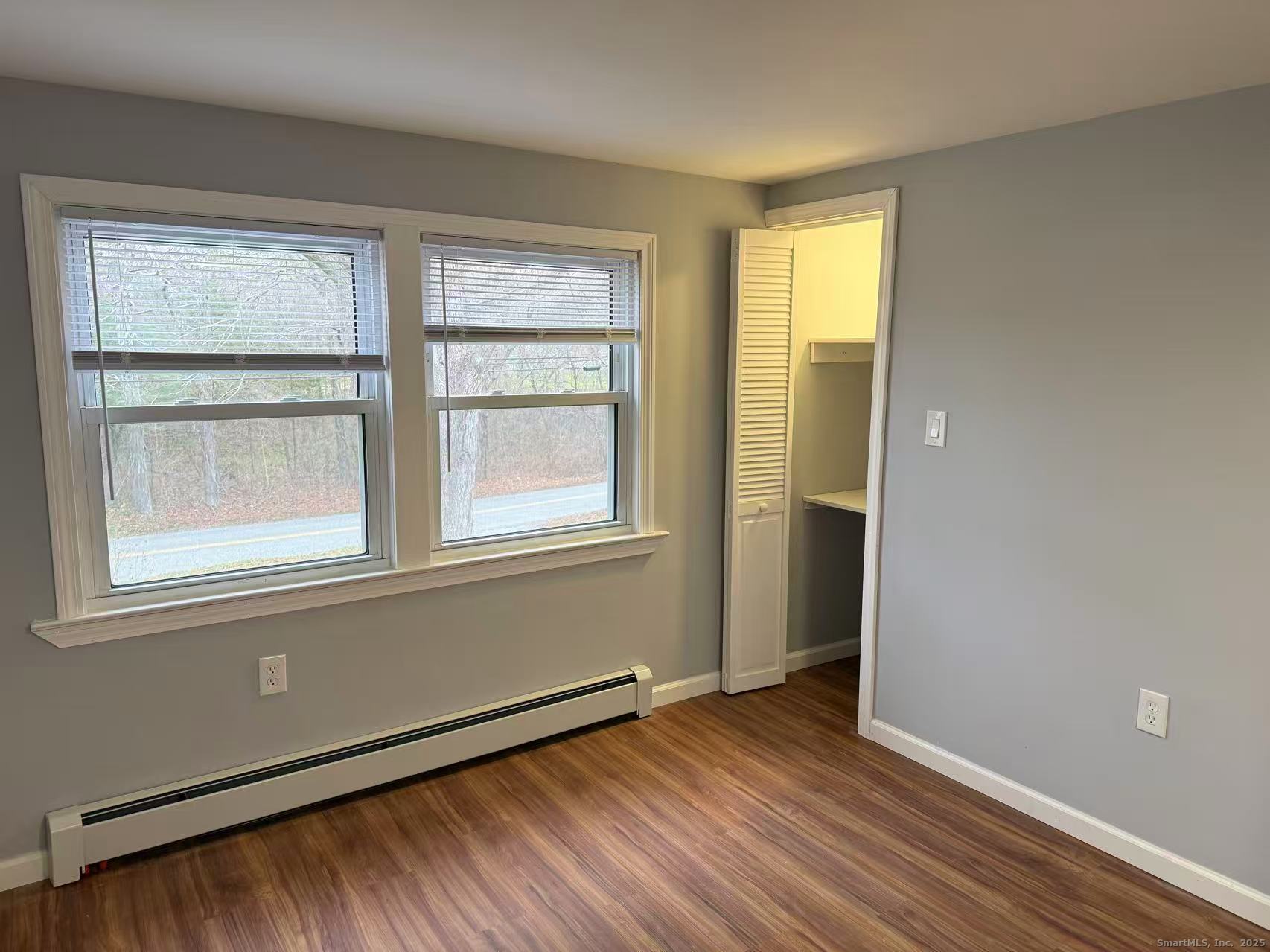 151 Bitgood Road Griswold, CT 06351 - Photo 15 of 20 an empty room with wooden floor and windows