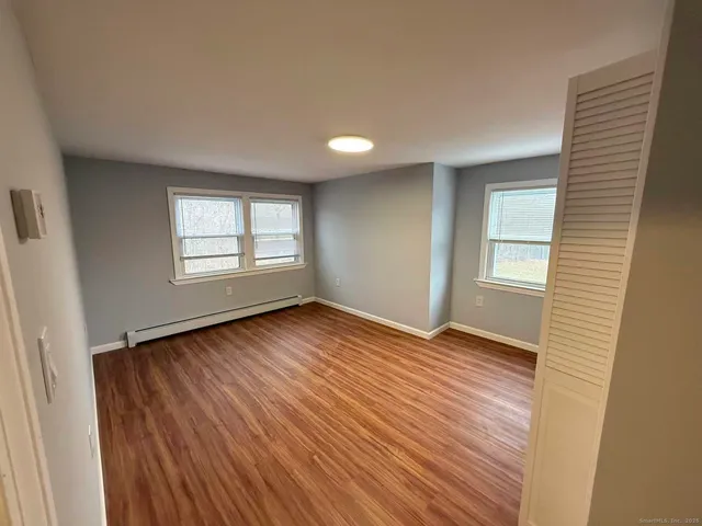 a front view of a house with swimming pool and porch