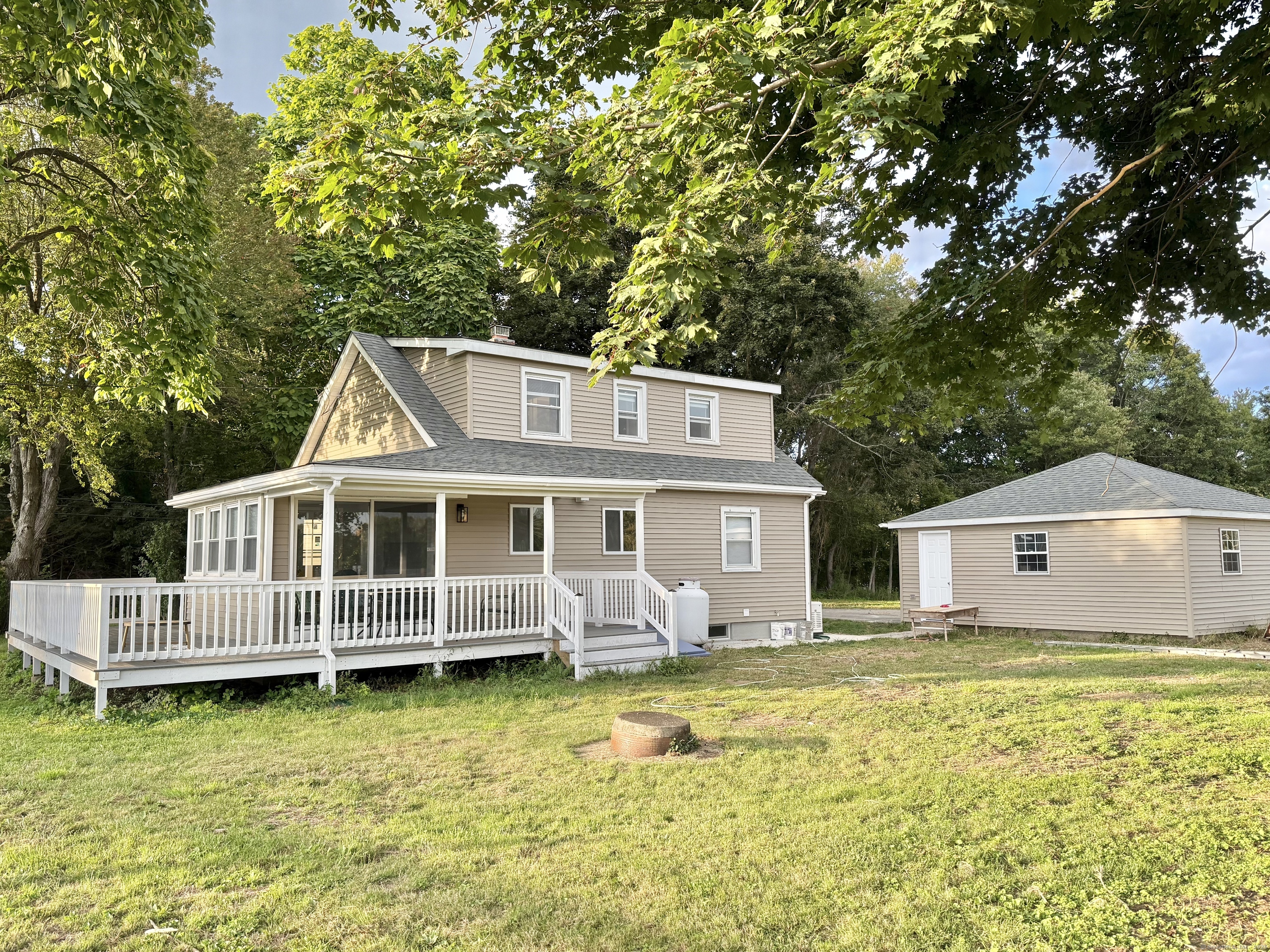 151 Bitgood Road Griswold, CT 06351 - Photo 19 of 20 a front view of a house with swimming pool and porch
