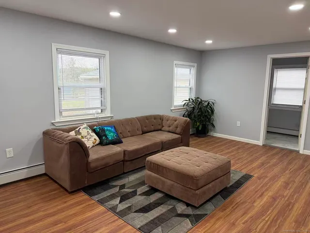 a living room with furniture and a window