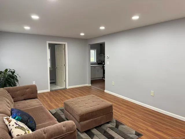 a bedroom with a bed and a couch