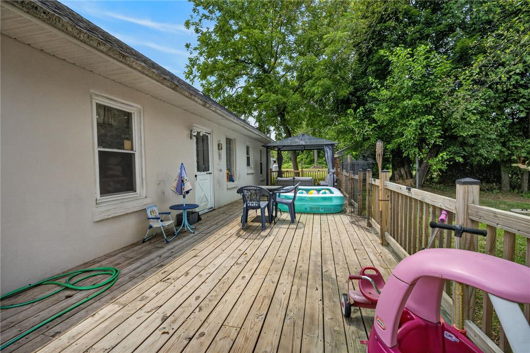3123 Orefield Road Allentown, PA 18104 - Photo 12 of 39 An inviting wood deck extends from the residence, offering a versatile space for outdoor enjoyment and relaxation.