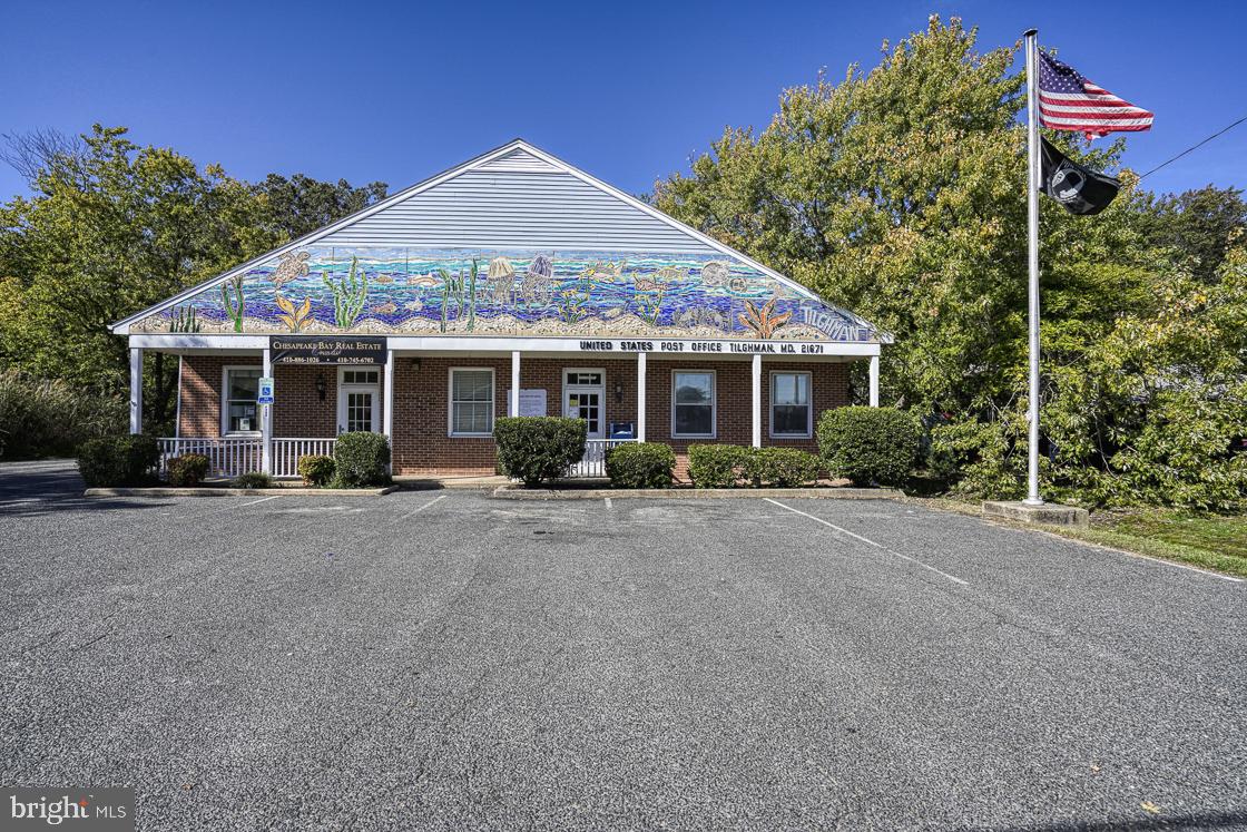Sinclair Avenue Tilghman, MD 21671 - Photo 10 of 10 a front view of a house with a garden