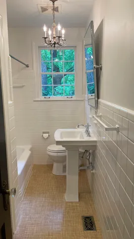 an empty room with wooden floor and closet