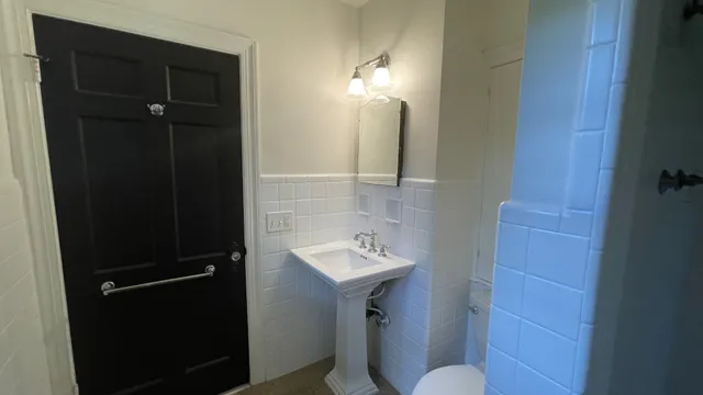 a view of empty room with wooden floor and fireplace