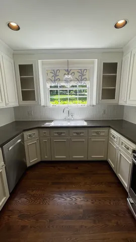 a view of front door with wooden floor