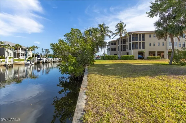 a view of a city with an ocean houses lake and ocean view