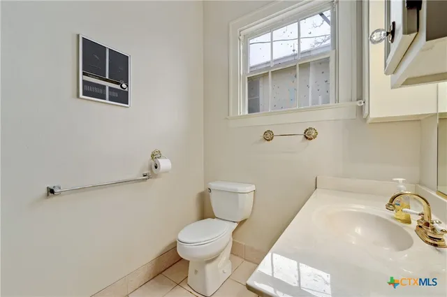 a bathroom with a toilet and a sink