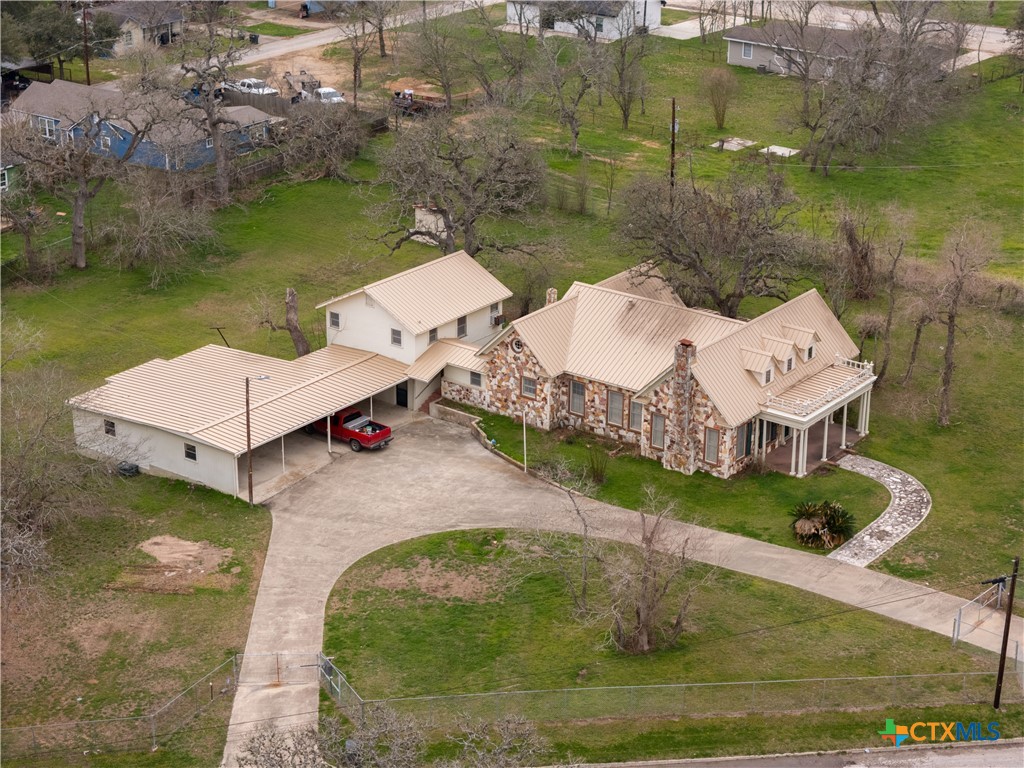 222 Myrtle Avenue Luling, TX 78648 - Photo 2 of 44 an aerial view of a house with a yard and lake view