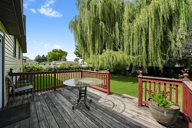 a view of a wooden deck with a bench