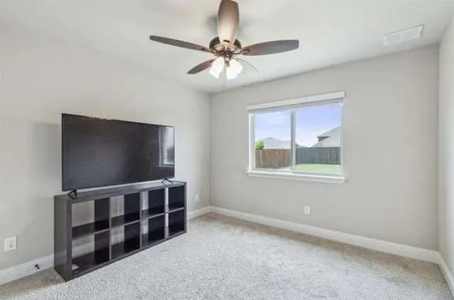 a front view of a house with a garden and deck