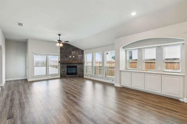 a view of a kitchen with a stove cabinets and wooden floor