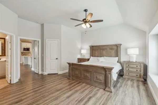 a view of kitchen with cabinets and wooden floor