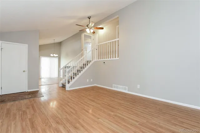 a view of an entryway with wooden floor